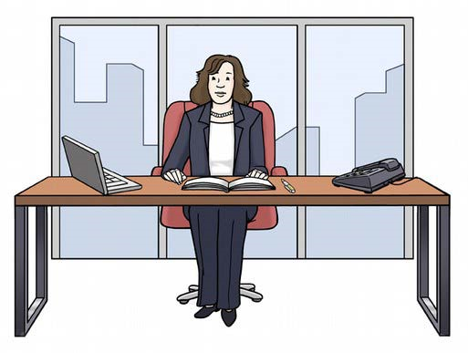 Eine Chefin sitzt an ihrem Schreibtisch.